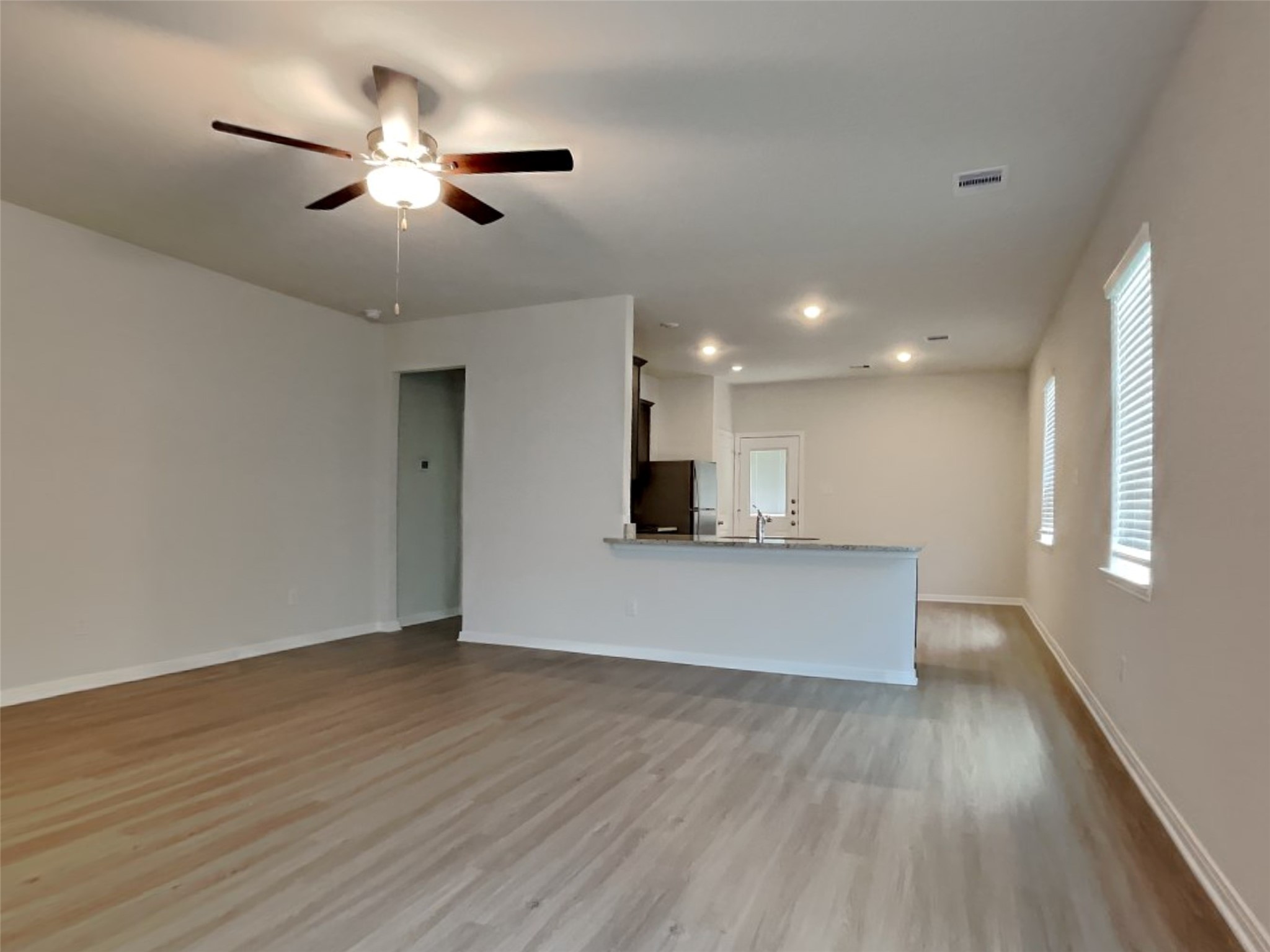 15419 Maple Ter Drive Conroe, TX 77303 - Photo 2 of 26 a view of an empty room and wooden floor
