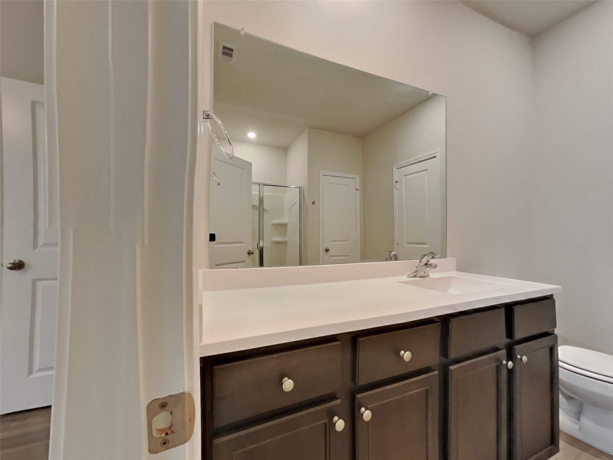 15419 Maple Ter Drive Conroe, TX 77303 - Photo 8 of 26 a bathroom with a sink and a mirror