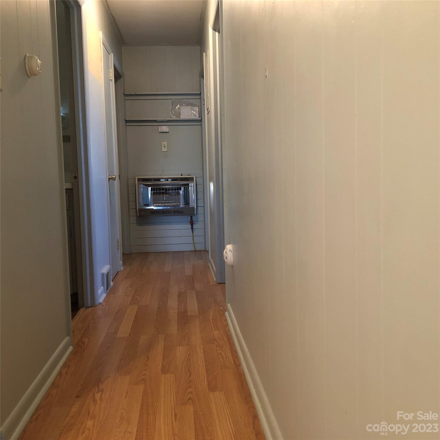 530 Shelton Road Clyde, NC 28721 - Photo 26 of 36 a view of a hallway with wooden floor