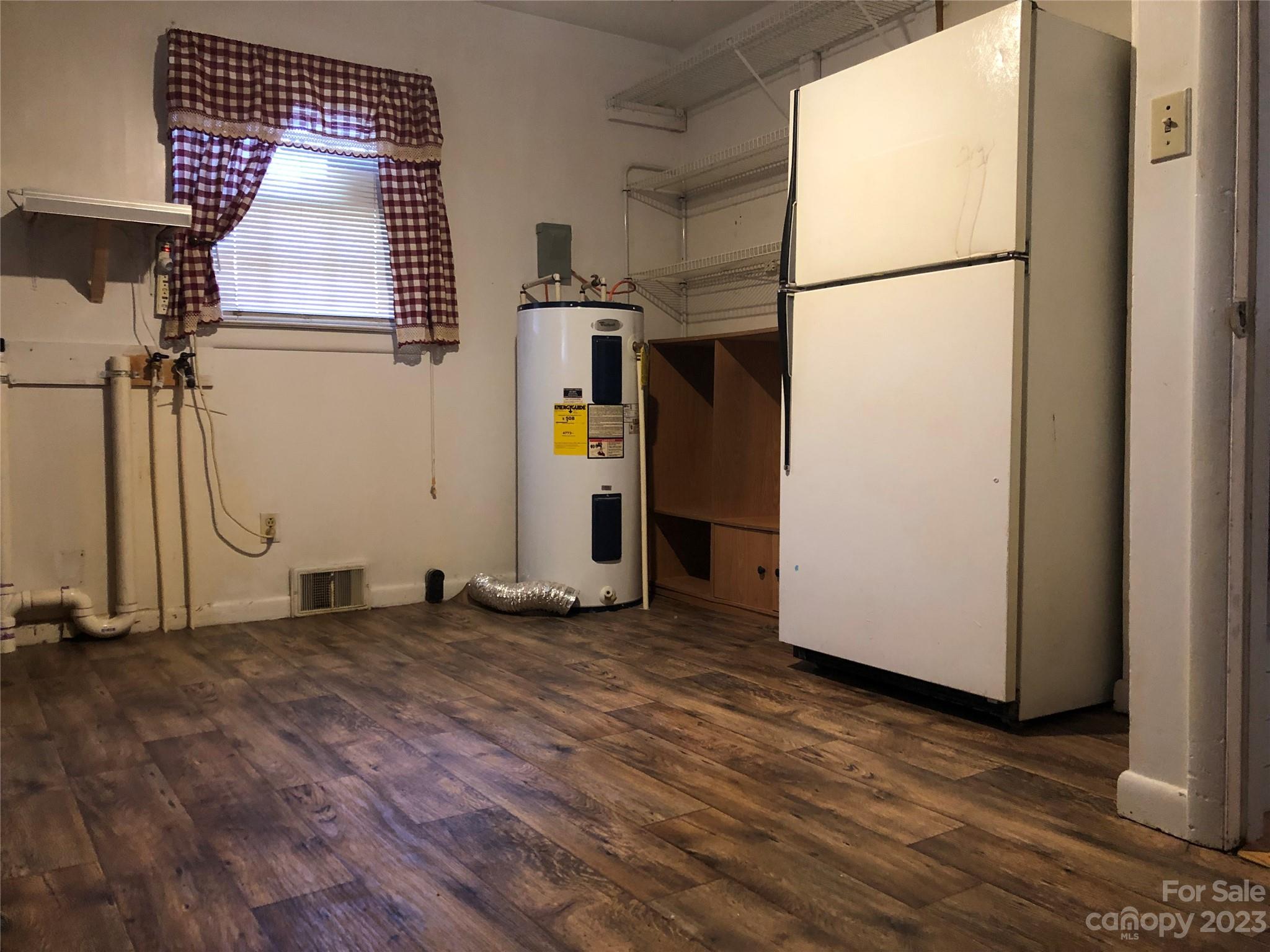 530 Shelton Road Clyde, NC 28721 - Photo 30 of 36 an empty room with wooden floor