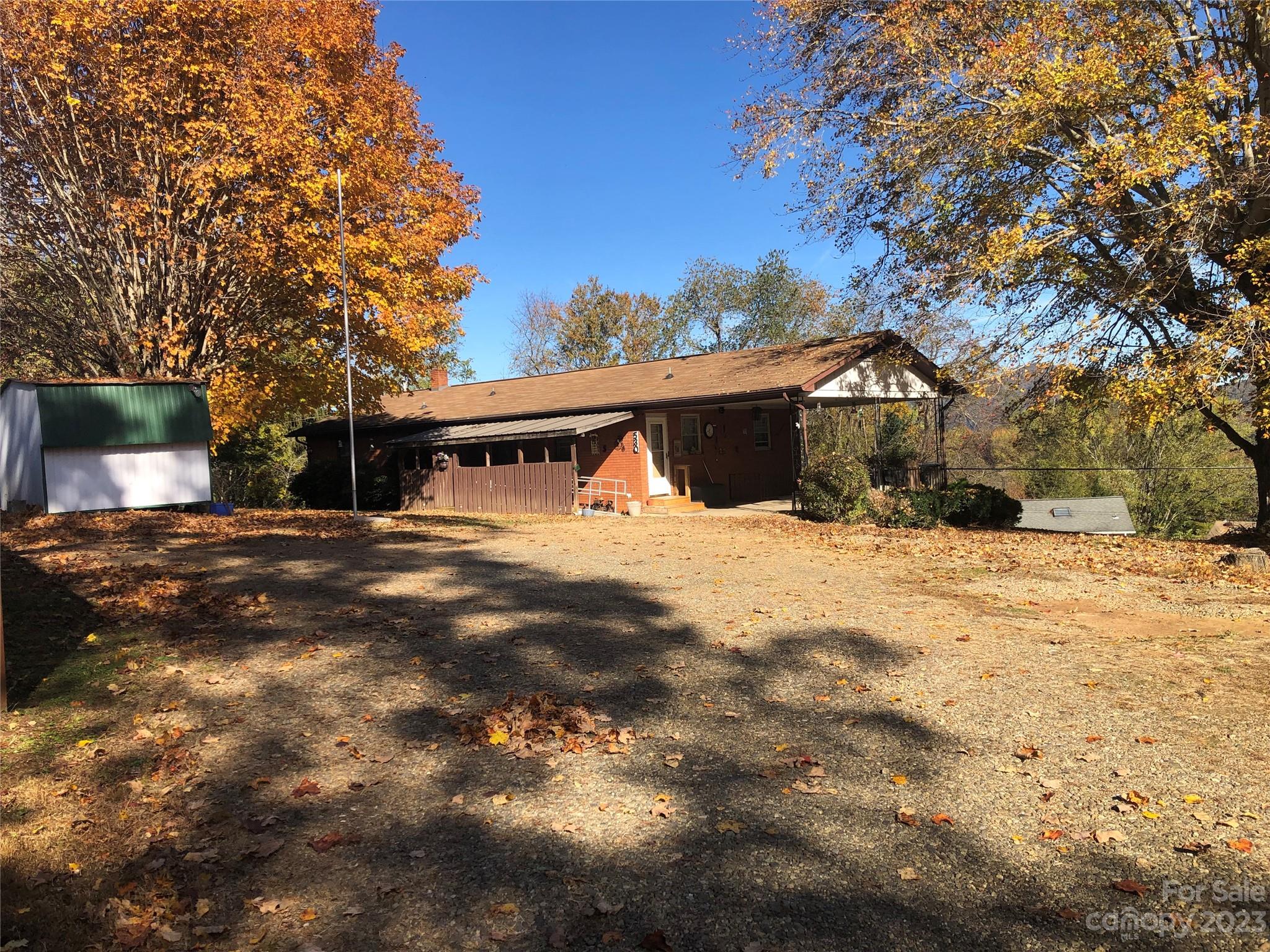 530 Shelton Road Clyde, NC 28721 - Photo 9 of 36 a view of a yard with a house