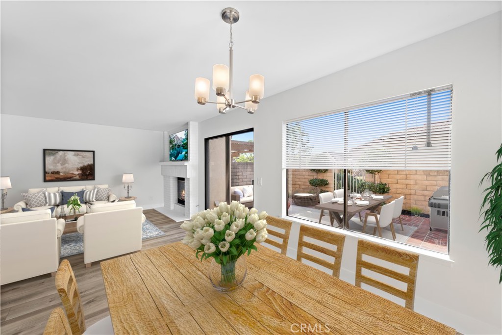 25702 Seaside Drive Dana Point, CA 92629 - Photo 11 of 37 a living room with furniture chandelier and wooden floor