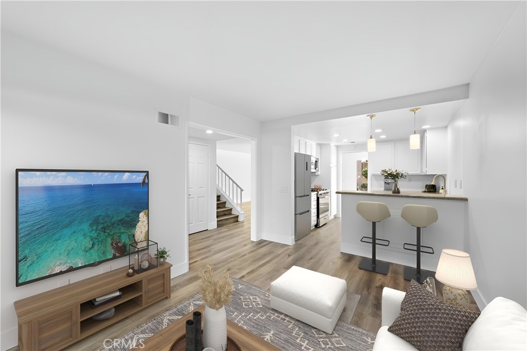 25702 Seaside Drive Dana Point, CA 92629 - Photo 13 of 37 a living room with furniture and a flat screen tv