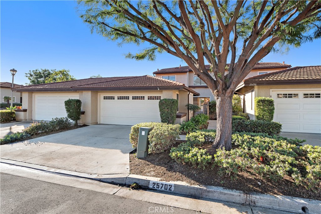25702 Seaside Drive Dana Point, CA 92629 - Photo 2 of 37 front view of a house with a tree