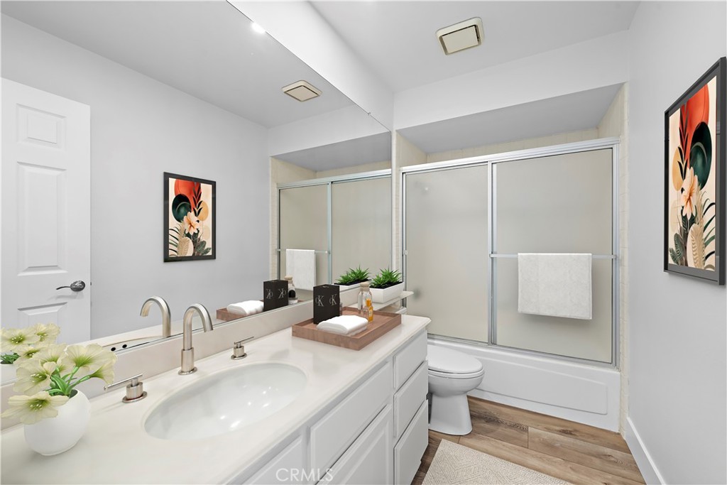 25702 Seaside Drive Dana Point, CA 92629 - Photo 22 of 37 a bathroom with a sink a toilet and shower