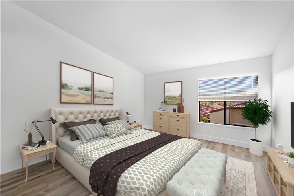 25702 Seaside Drive Dana Point, CA 92629 - Photo 23 of 37 a bedroom with a large bed and a large window