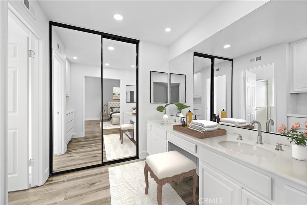 25702 Seaside Drive Dana Point, CA 92629 - Photo 25 of 37 a large bathroom with a glass door shower and sink