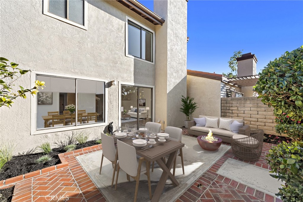 25702 Seaside Drive Dana Point, CA 92629 - Photo 29 of 37 a view of a patio with couple of chairs and a table