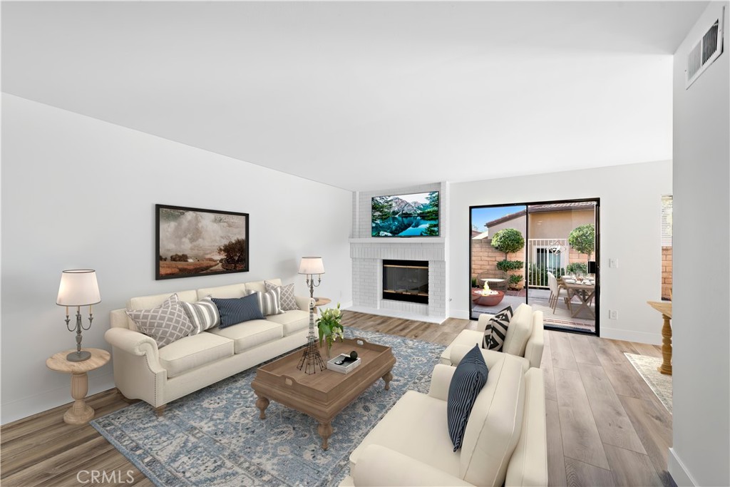 25702 Seaside Drive Dana Point, CA 92629 - Photo 7 of 37 a living room with furniture and a fireplace