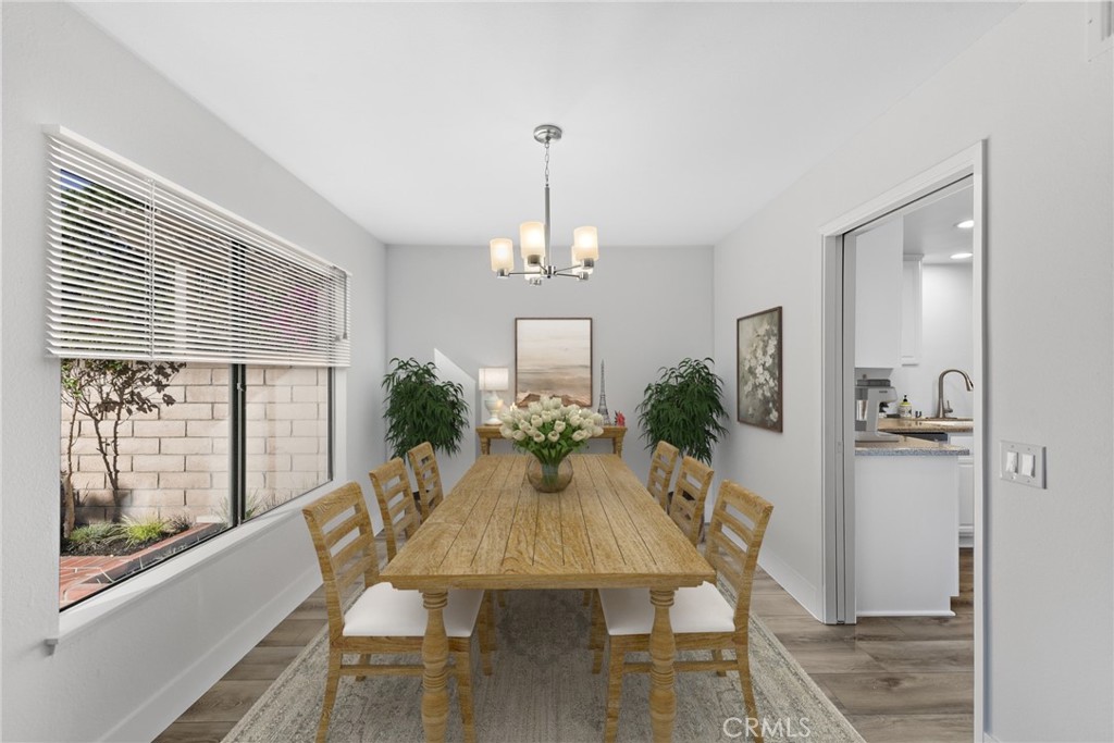 25702 Seaside Drive Dana Point, CA 92629 - Photo 10 of 37 a view of a dining room with furniture window and wooden floor