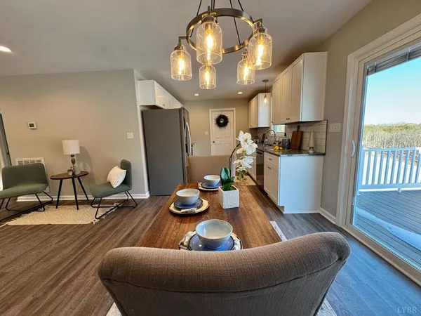 a view of a dining room with furniture window and outside view