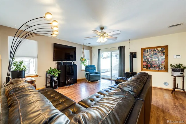 a living room with furniture fireplace and flat screen tv