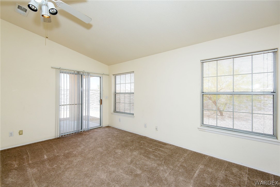 3395 Pegasus Ranch Lane Bullhead City, AZ 86429 - Photo 27 of 50 an empty room with windows