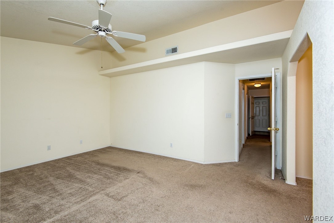 3395 Pegasus Ranch Lane Bullhead City, AZ 86429 - Photo 29 of 50 a view of a hallway with a yellow space