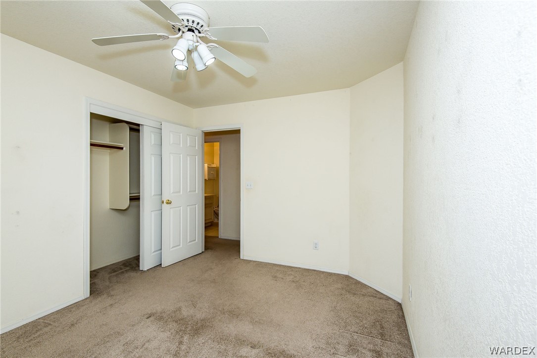 3395 Pegasus Ranch Lane Bullhead City, AZ 86429 - Photo 41 of 50 a view of an empty room and chandelier fan