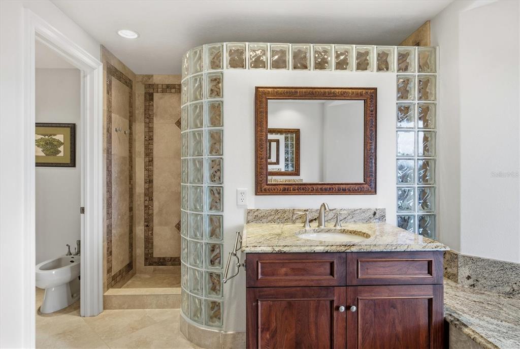 761 Norton Street Longboat Key, FL 34228 - Photo 46 of 66 a bathroom with a granite countertop sink a toilet and shower