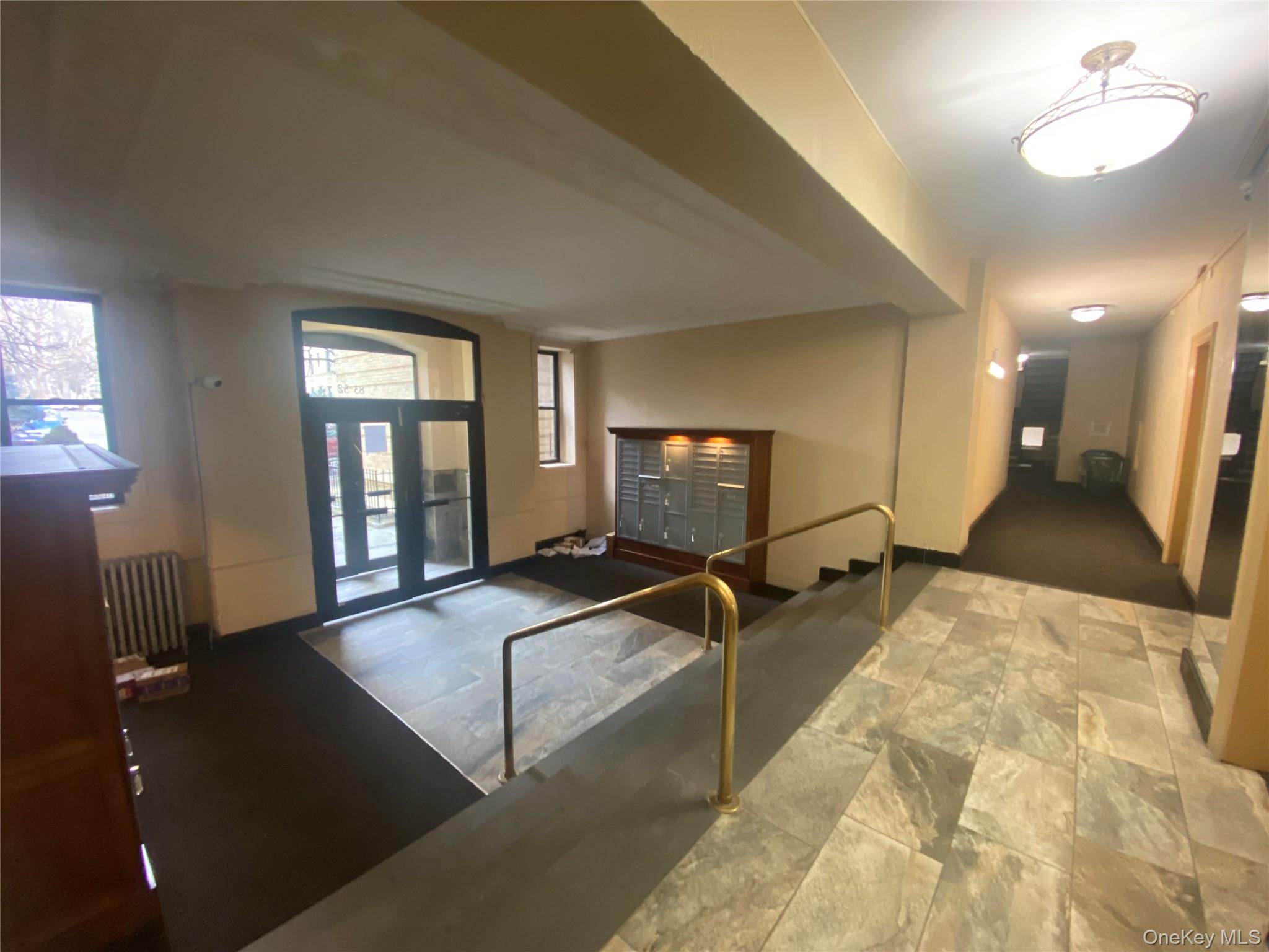 83-52 Talbot Street, Unit 2H Queens, NY 11415 - Photo 11 of 13 a view of a room with gym equipment