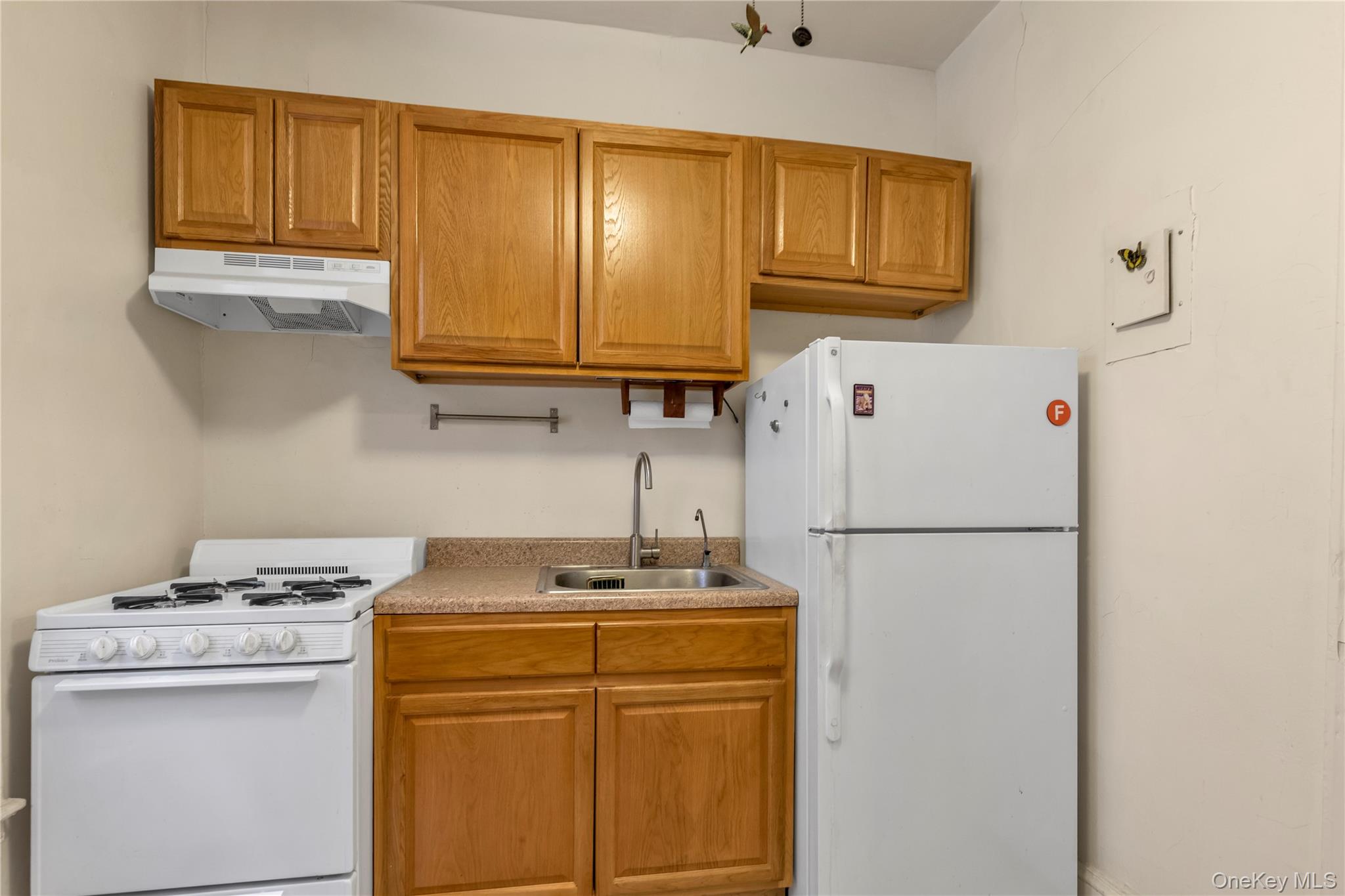 83-52 Talbot Street, Unit 2H Queens, NY 11415 - Photo 5 of 13 a utility room with dryer and washer