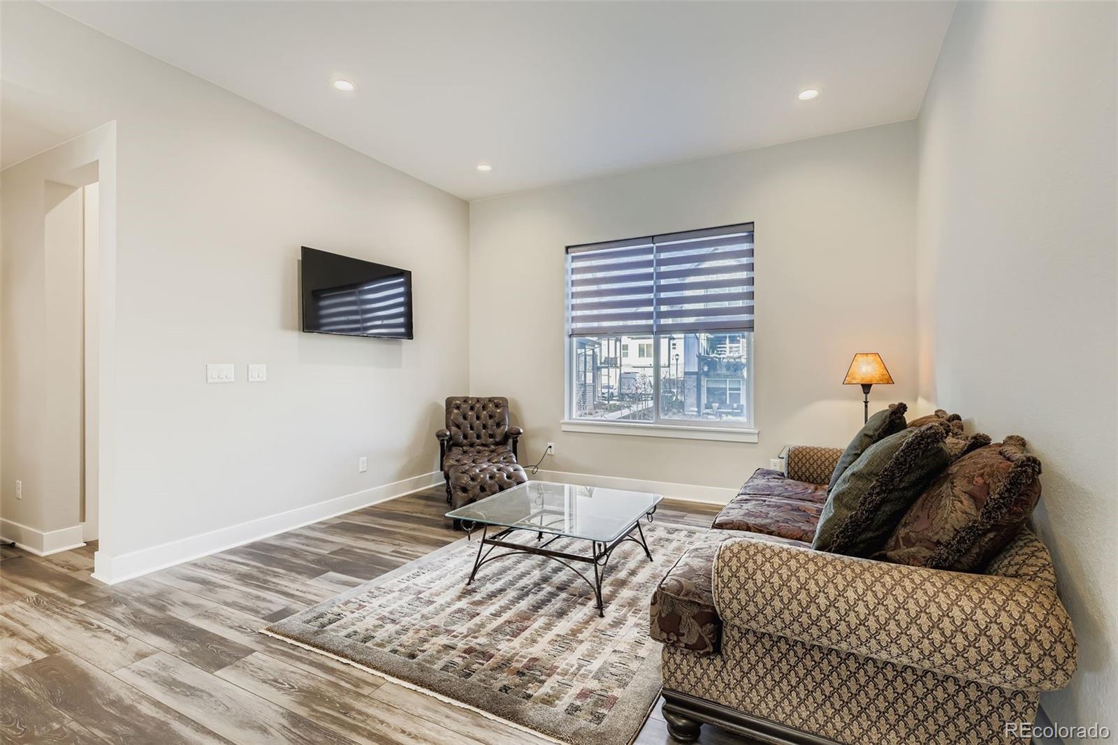 12355 West 51st Avenue Wheat Ridge, CO 80033 - Photo 3 of 17 a bed room with a bed and a window