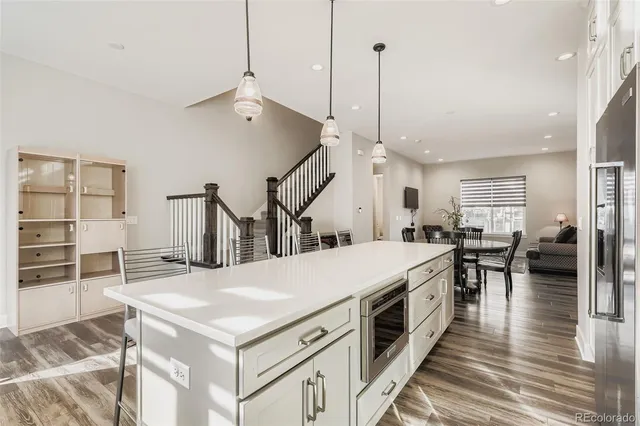 a open kitchen with a table and chairs