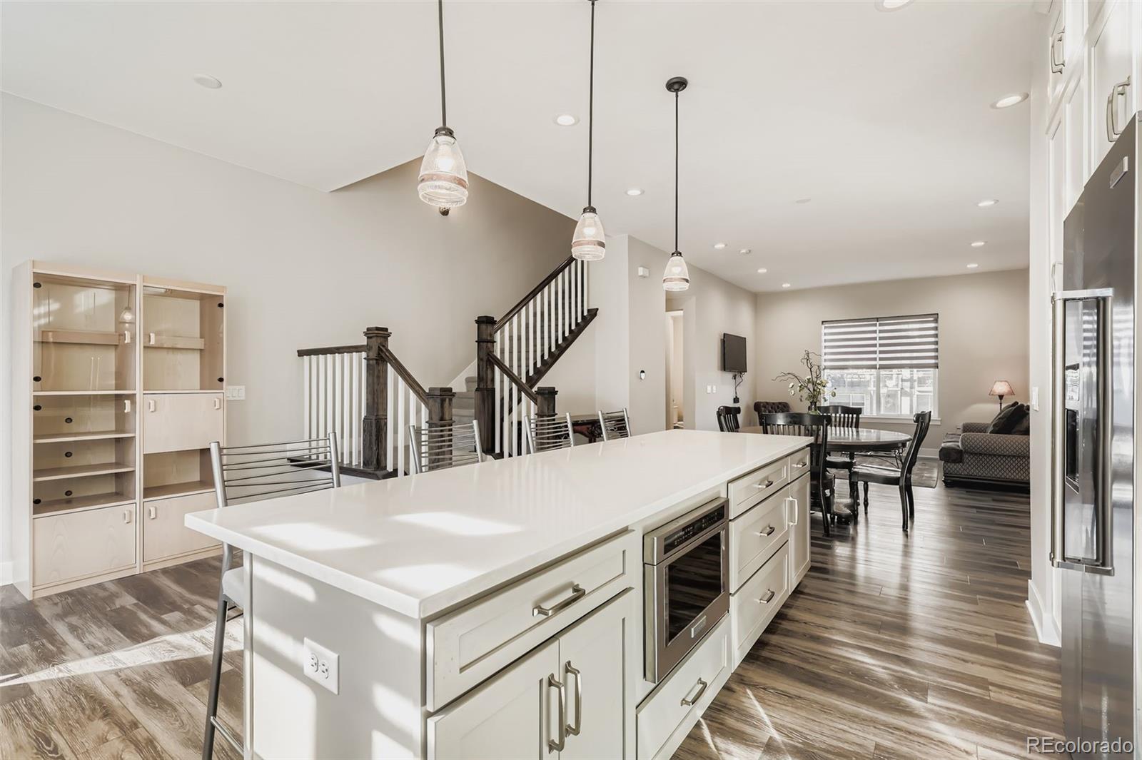 12355 West 51st Avenue Wheat Ridge, CO 80033 - Photo 7 of 17 a open kitchen with a table and chairs