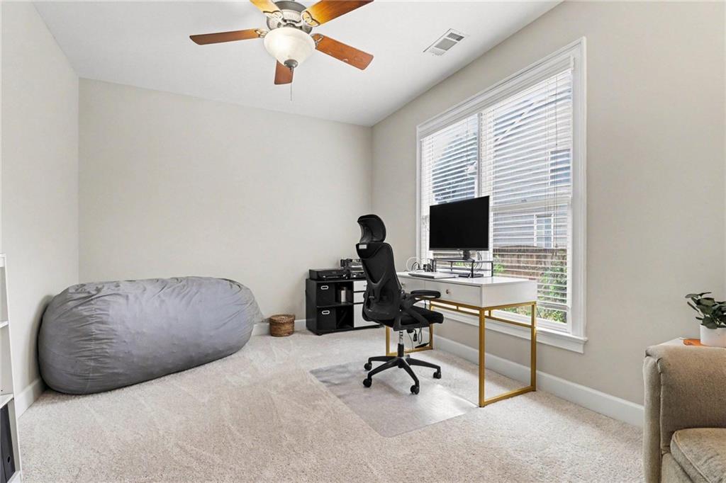 12552 Waterside Drive Alpharetta, GA 30004 - Photo 12 of 33 a bedroom with furniture and a window