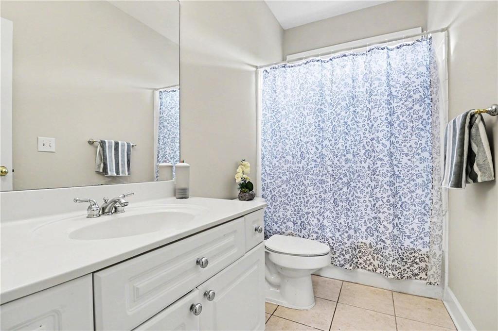 12552 Waterside Drive Alpharetta, GA 30004 - Photo 13 of 33 a bathroom with a sink toilet and shower