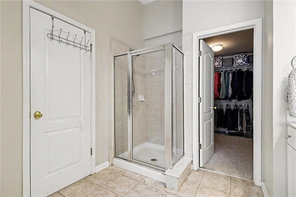 12552 Waterside Drive Alpharetta, GA 30004 - Photo 18 of 33 a bathroom with a shower and a sink