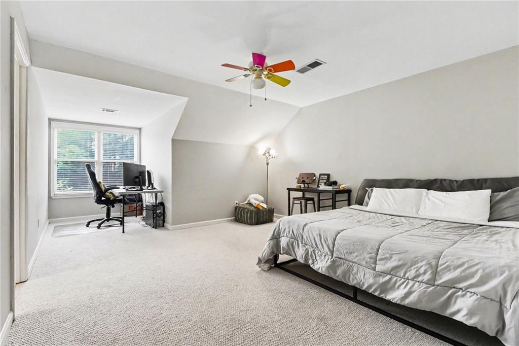 12552 Waterside Drive Alpharetta, GA 30004 - Photo 25 of 33 a bedroom with a bed and furniture
