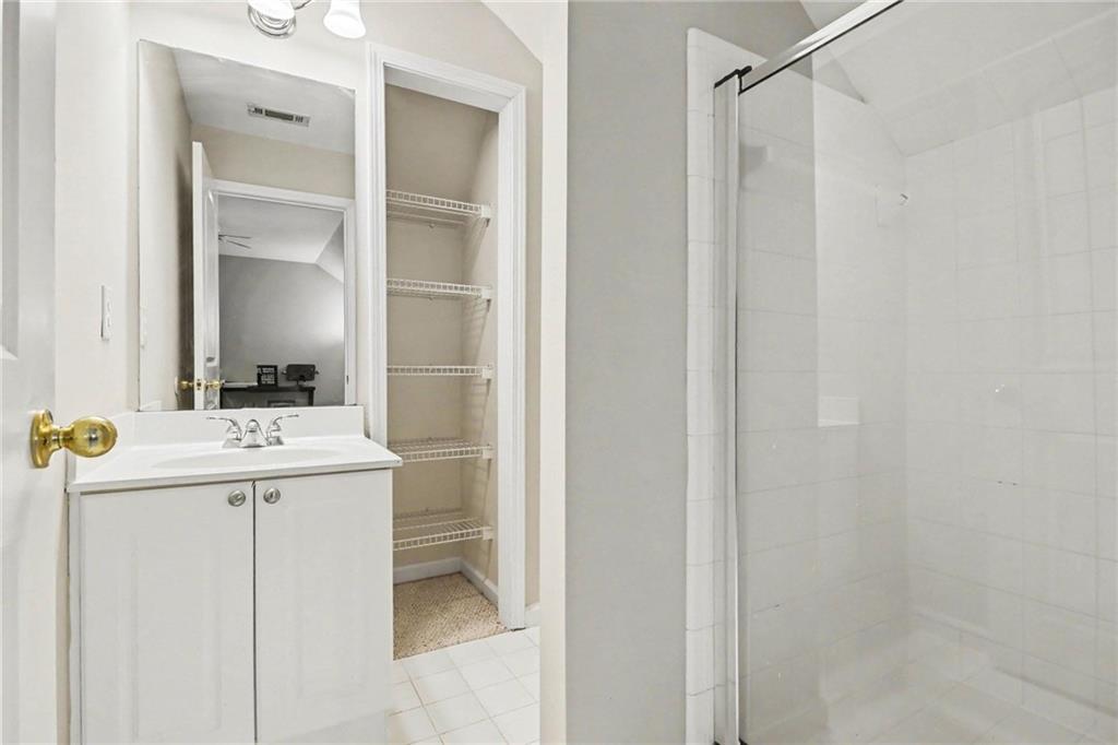 12552 Waterside Drive Alpharetta, GA 30004 - Photo 26 of 33 a bathroom with a sink and mirror
