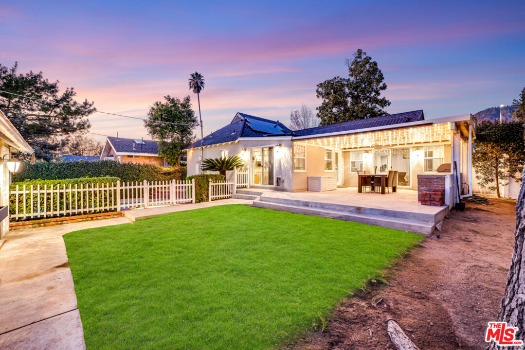 a view of a porch and garden