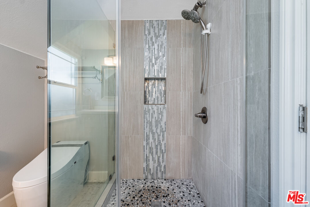 3330 Hermanos Street Pasadena, CA 91107 - Photo 17 of 40 a bathroom with a shower toilet and sink