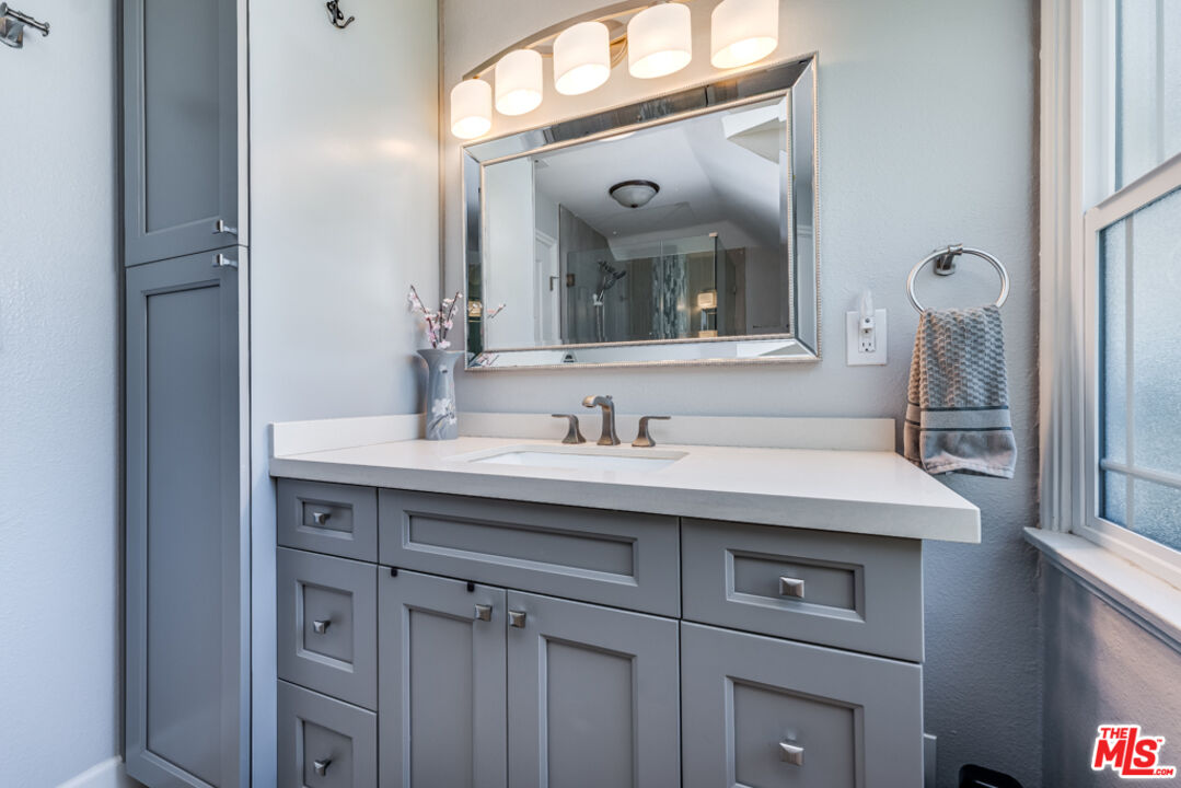 3330 Hermanos Street Pasadena, CA 91107 - Photo 18 of 40 a bathroom with a sink and a mirror