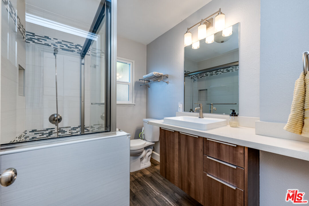 3330 Hermanos Street Pasadena, CA 91107 - Photo 20 of 40 a bathroom with a sink and mirror