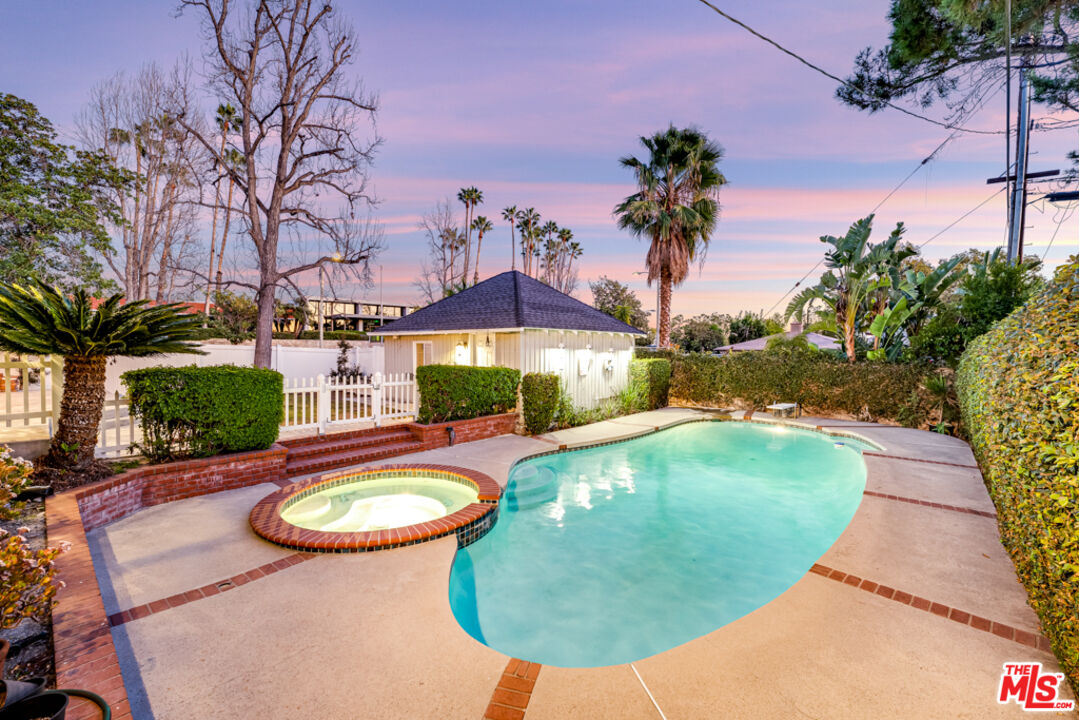 3330 Hermanos Street Pasadena, CA 91107 - Photo 2 of 40 a view of a swimming pool with a yard