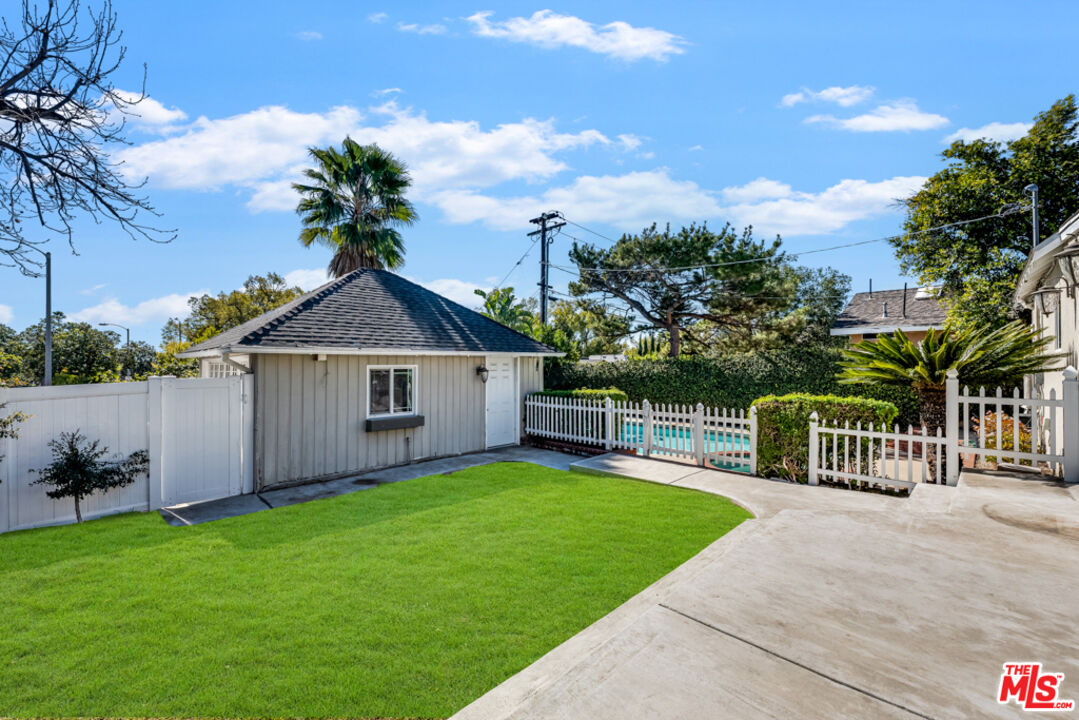 3330 Hermanos Street Pasadena, CA 91107 - Photo 26 of 40 a view of a house with a yard and fence