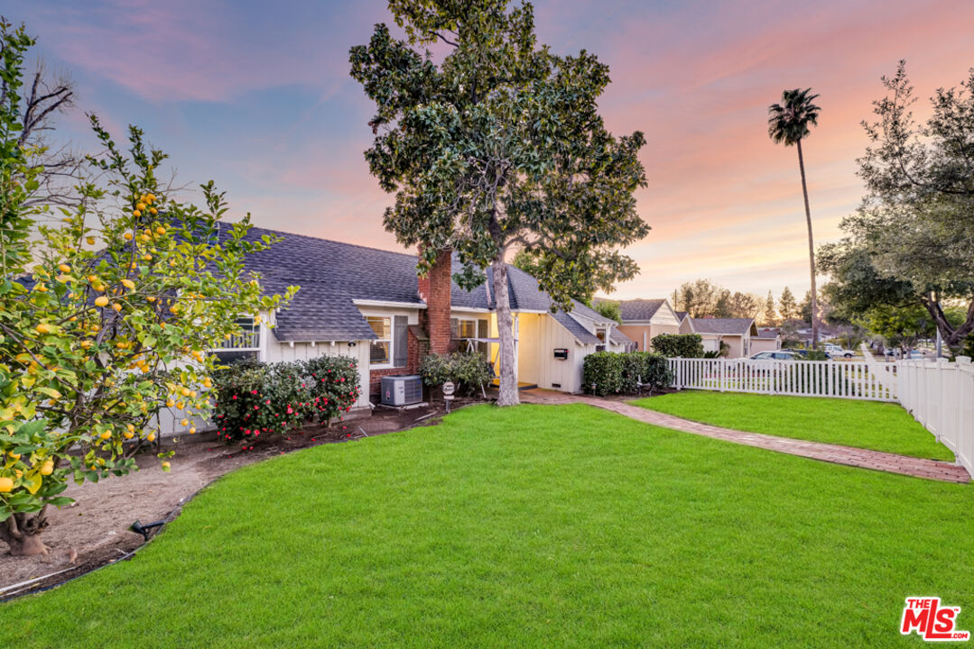 3330 Hermanos Street Pasadena, CA 91107 - Photo 30 of 40 a view of a house with a big yard and fountain