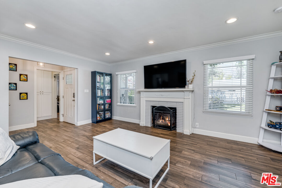 3330 Hermanos Street Pasadena, CA 91107 - Photo 8 of 40 a living room with furniture large window and a fireplace