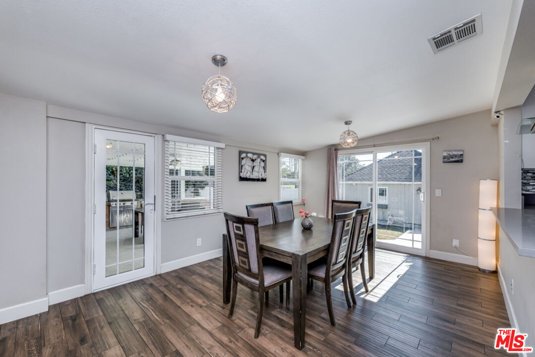 3330 Hermanos Street Pasadena, CA 91107 - Photo 9 of 40 a view of a dining room with furniture and wooden floor