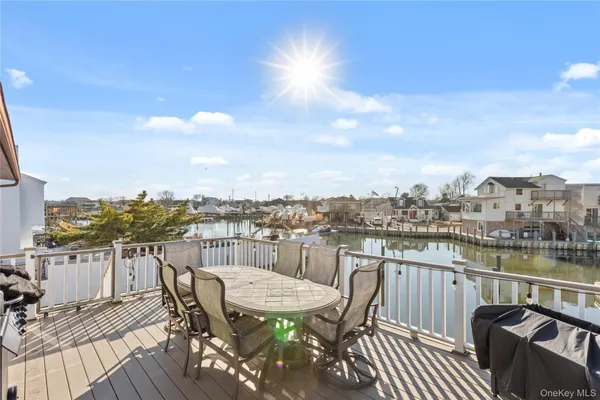 a view of a roof deck with furniture