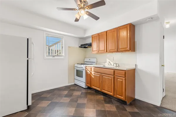 a kitchen with stainless steel appliances granite countertop a sink and cabinets