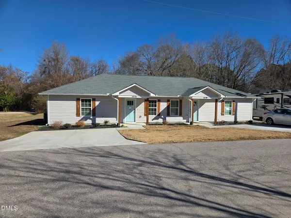 a house with trees in the background