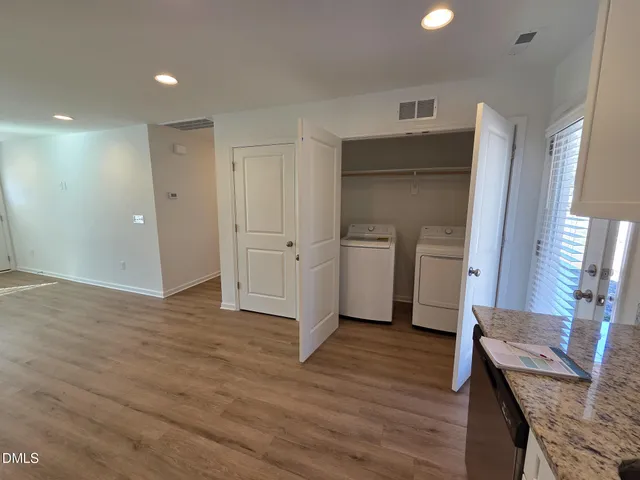a view of entryway with wooden floor