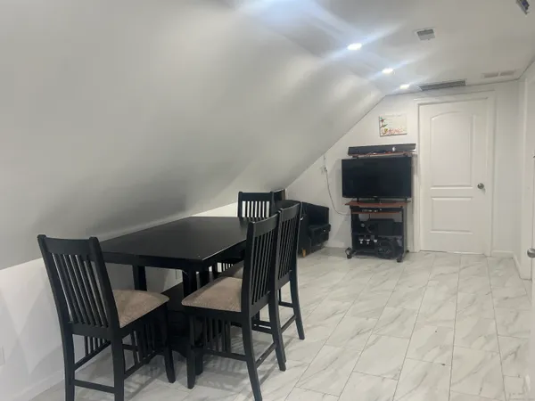 a view of a dining room with furniture