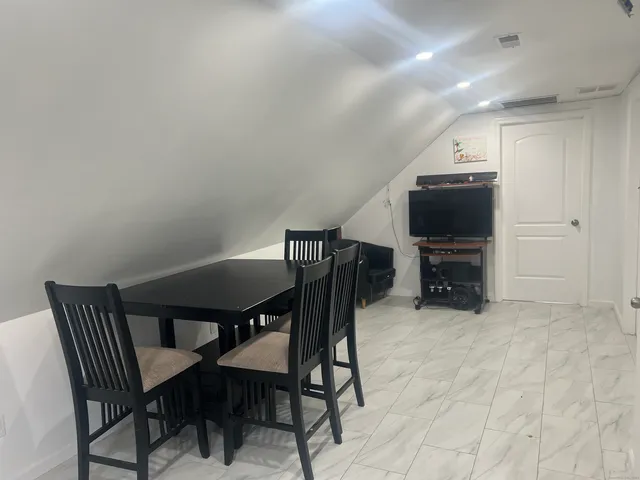 a view of a dining room with furniture