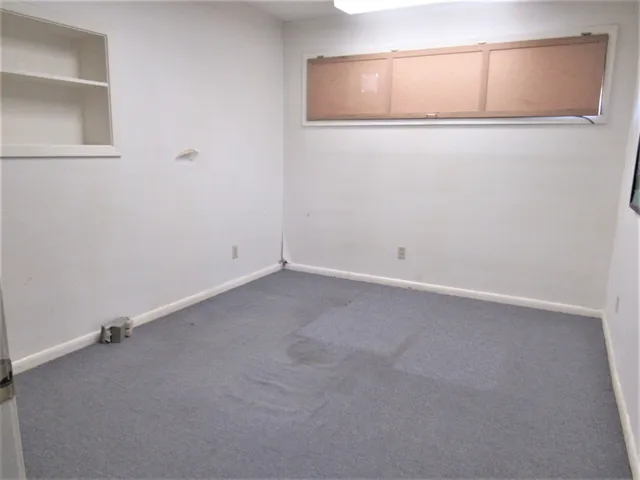 an empty room with a bench