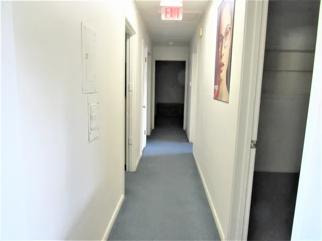 a utility room with cabinets washer and dryer