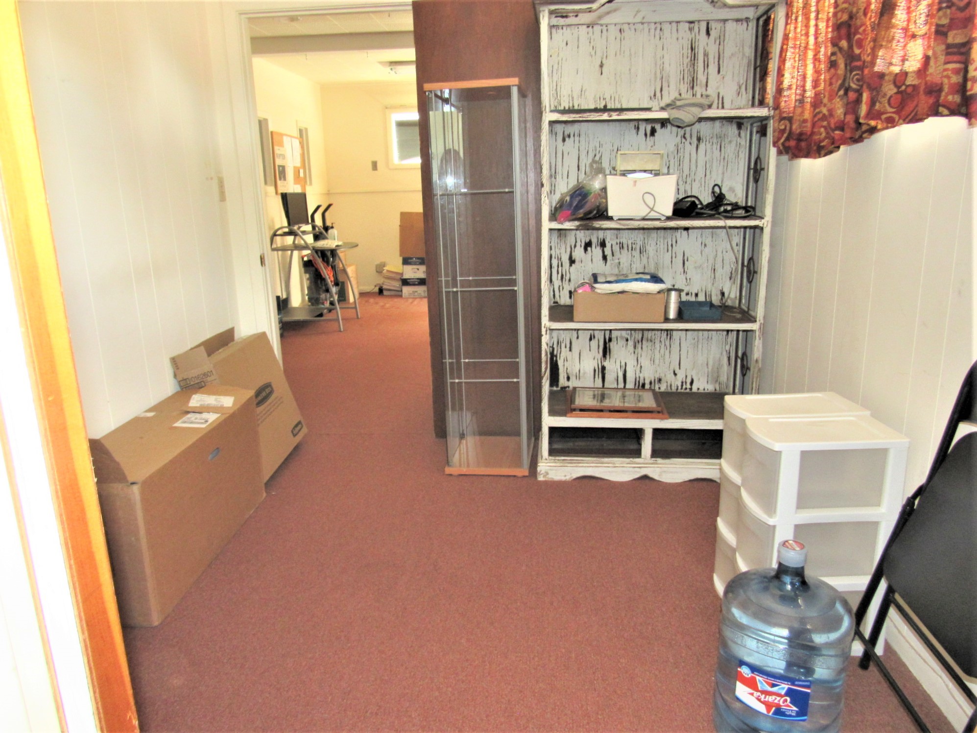 1116 North Fulton Street Wharton, TX 77488 - Photo 18 of 45 a view of walk in closet with empty racks
