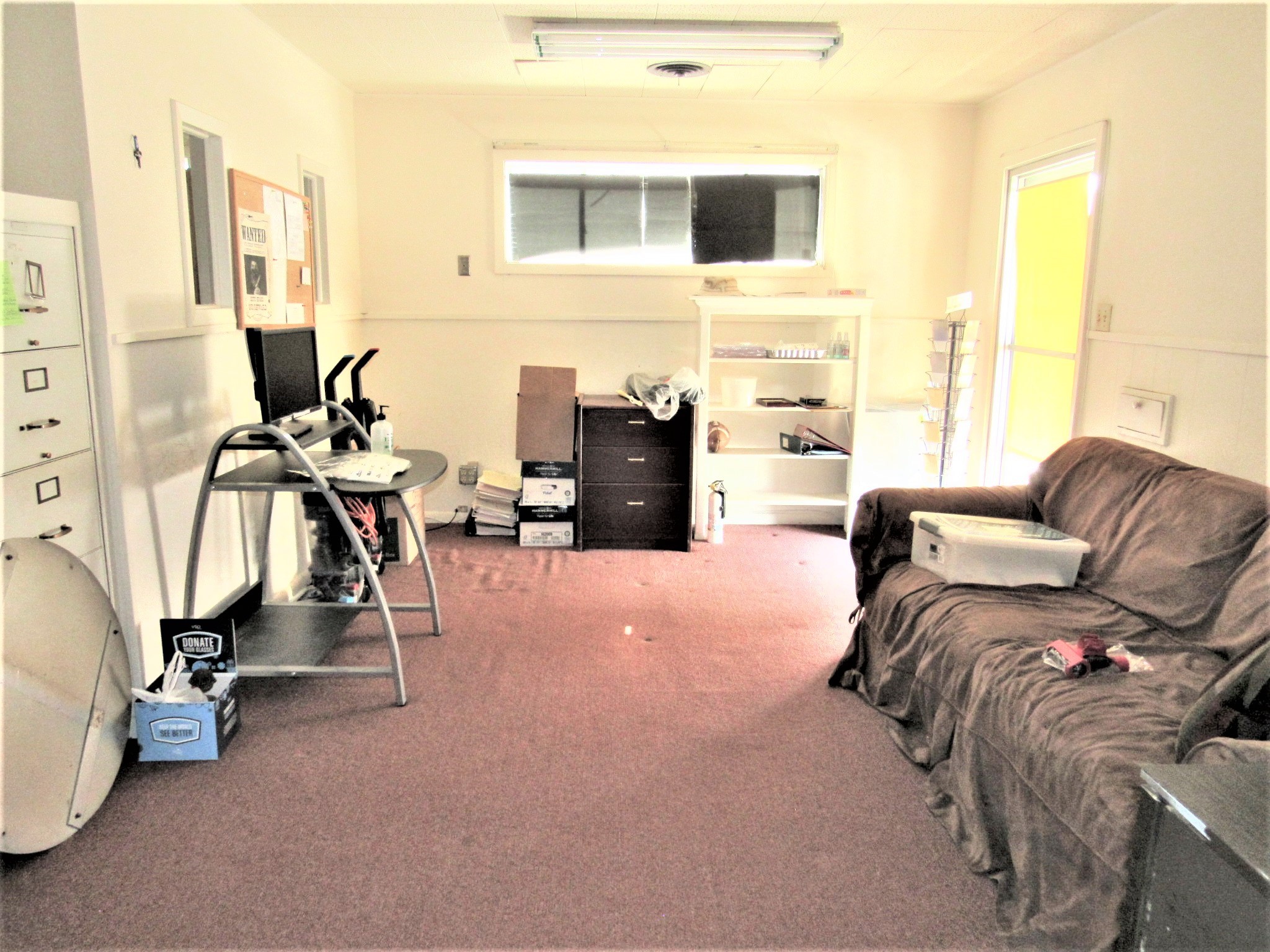 1116 North Fulton Street Wharton, TX 77488 - Photo 19 of 45 a living room with furniture and a flat screen tv