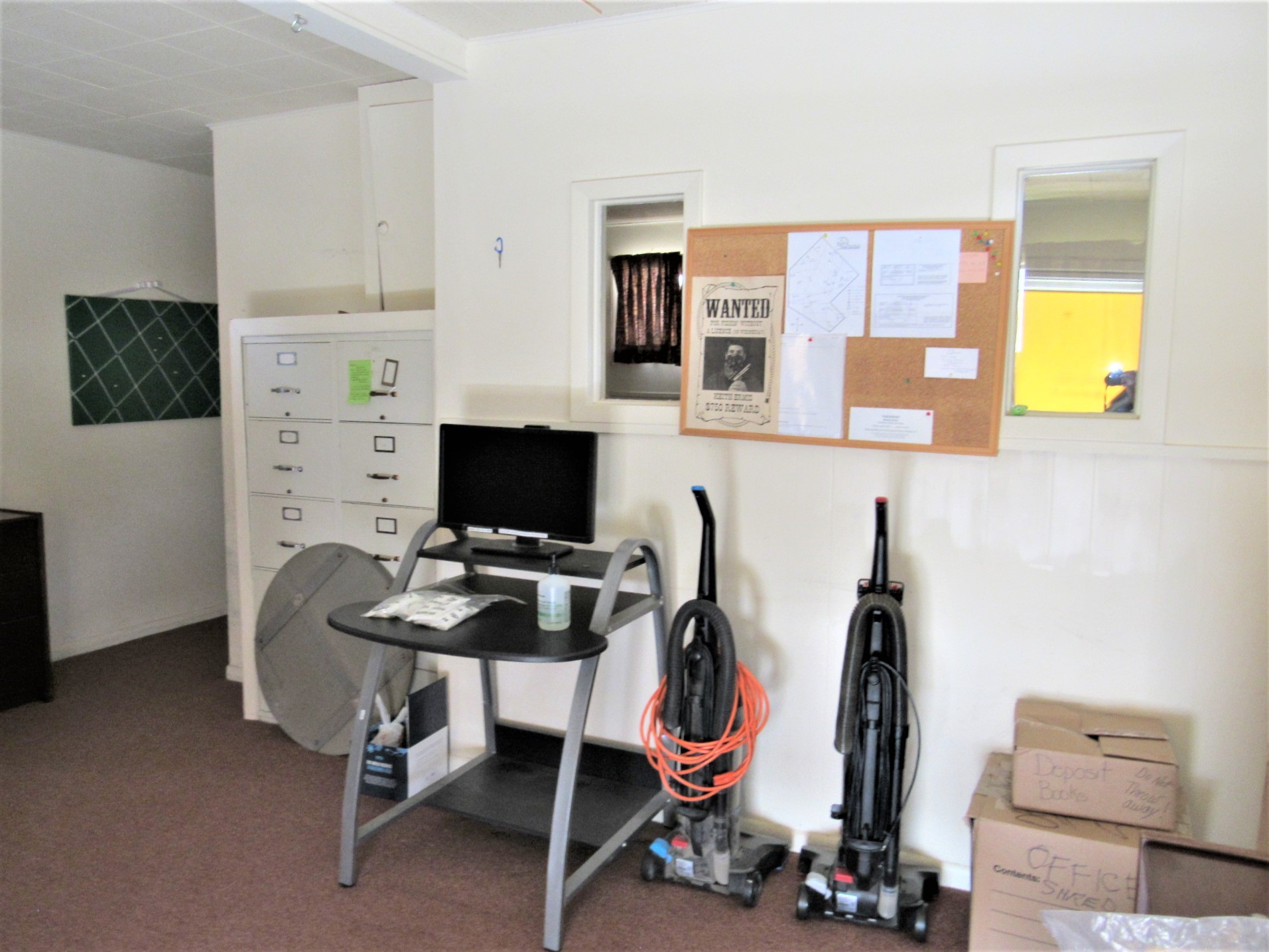 1116 North Fulton Street Wharton, TX 77488 - Photo 20 of 45 a view of a workspace with furniture and a flat screen tv